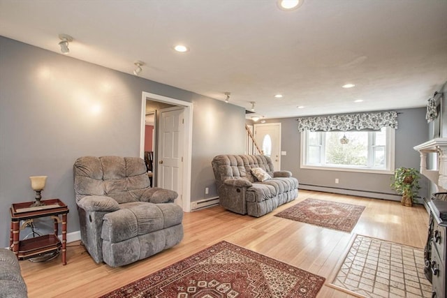 374 Forest St, Raynham, MA 02767 - living room featuring wood finished floors, a baseboard heating unit, a baseboard radiator, recessed lighting, and baseboards