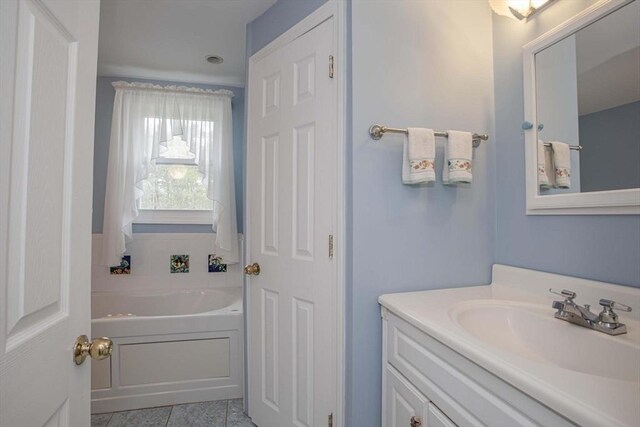 374 Forest St, Raynham, MA 02767 - bathroom featuring a bath, vanity, and tile patterned floors