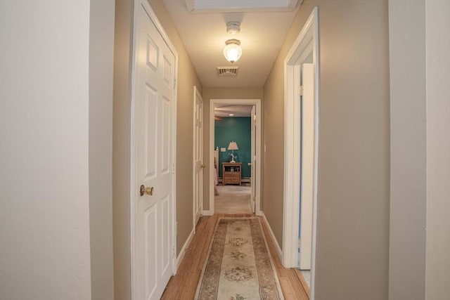 374 Forest St, Raynham, MA 02767 - hallway with light wood-style floors and baseboards