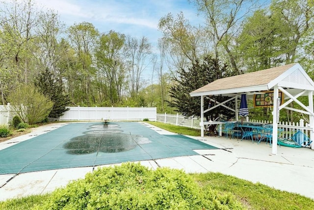 374 Forest St, Raynham, MA 02767 - view of swimming pool featuring a fenced backyard, a gazebo, and view of scattered trees