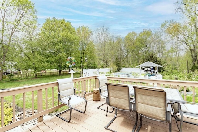 374 Forest St, Raynham, MA 02767 - wooden deck with outdoor dining area and view of scattered trees