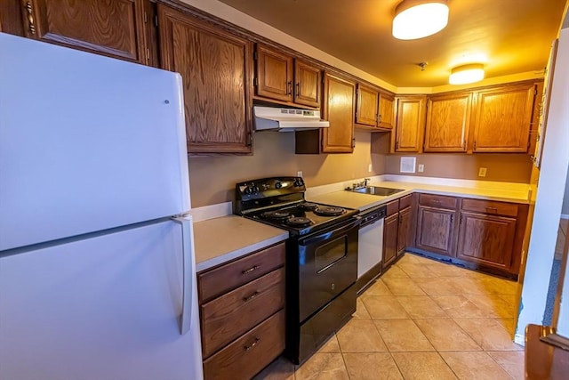 kitchen with light tile patterned flooring, black electric range oven, sink, white refrigerator, and dishwashing machine