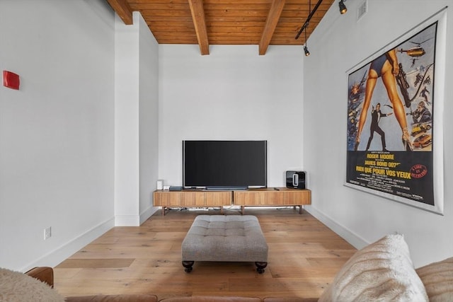 living room with beam ceiling, light wood-type flooring, and wooden ceiling