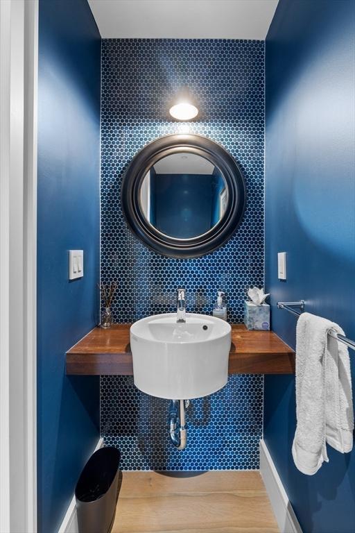 bathroom with sink and hardwood / wood-style flooring