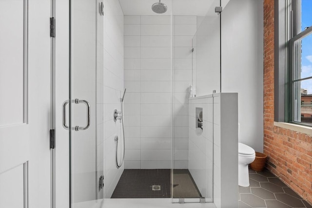 bathroom with toilet, an enclosed shower, and tile patterned flooring