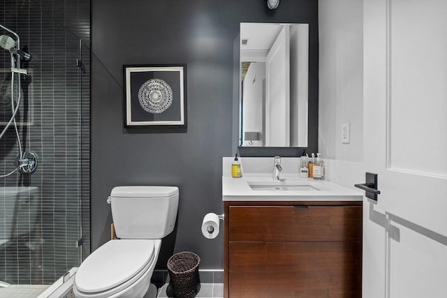 bathroom featuring walk in shower, vanity, and toilet