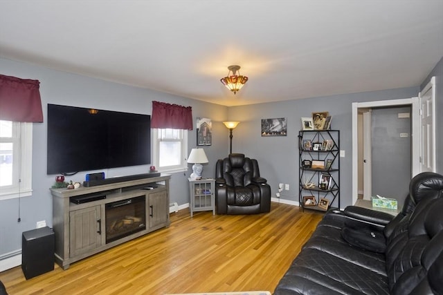 living room featuring light hardwood / wood-style flooring and a baseboard radiator