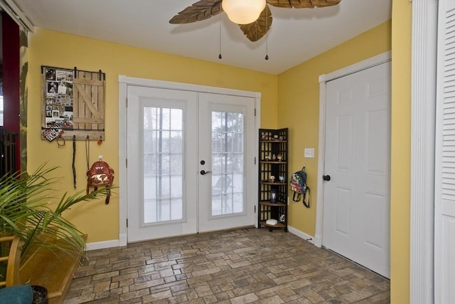 doorway to outside with ceiling fan and french doors