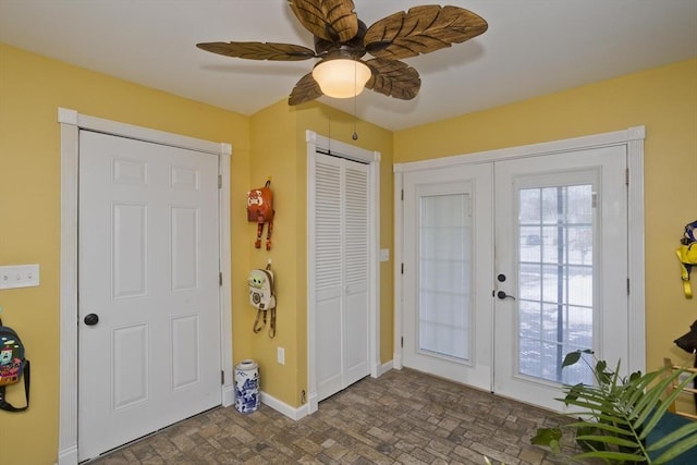 entryway with ceiling fan and french doors