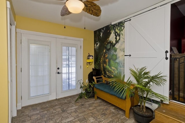 doorway featuring ceiling fan and french doors