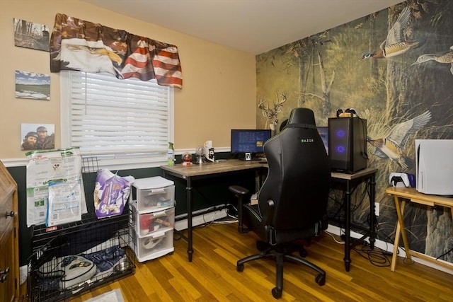 home office with hardwood / wood-style flooring and baseboard heating