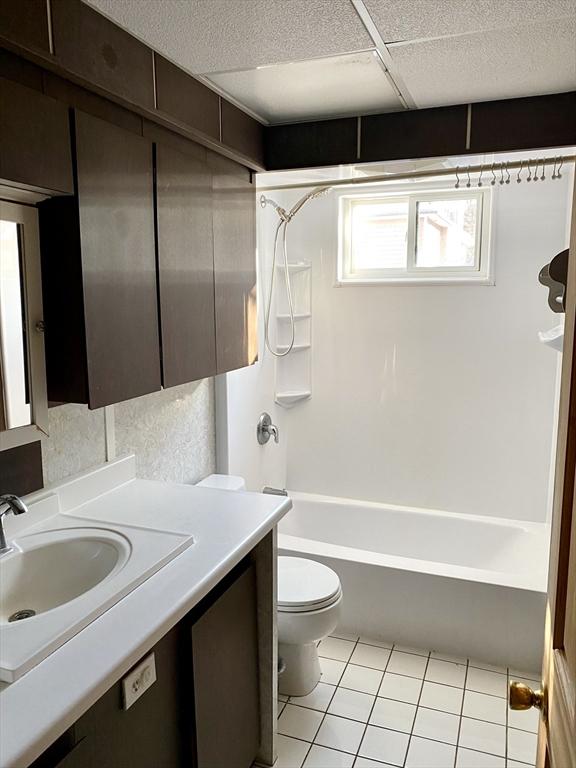 full bathroom with tile patterned flooring, shower / washtub combination, vanity, and toilet