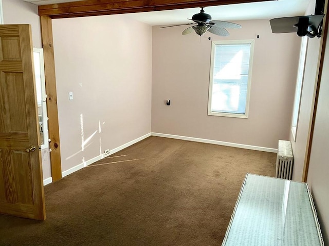 carpeted spare room featuring radiator heating unit and ceiling fan