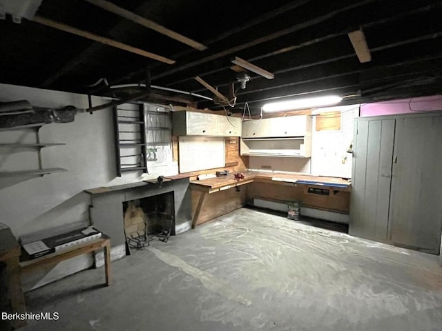 unfinished below grade area with a workshop area