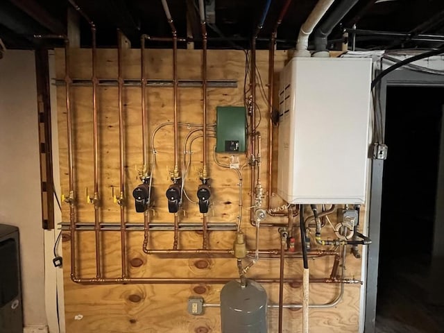 utility room featuring water heater