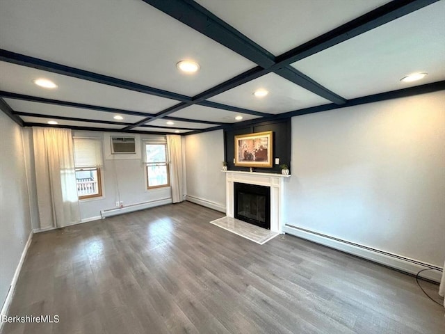 unfurnished living room with beamed ceiling, wood finished floors, a baseboard heating unit, and baseboard heating