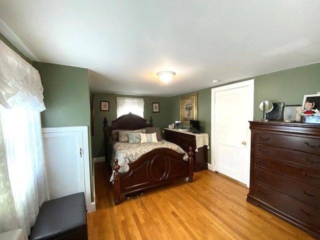 bedroom with light hardwood / wood-style flooring