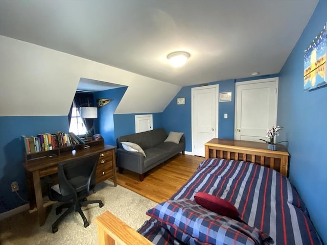 office area featuring hardwood / wood-style flooring and lofted ceiling