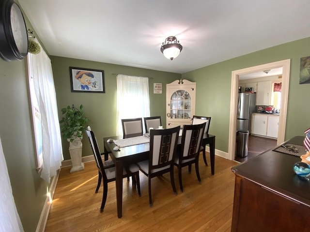 dining area with hardwood / wood-style flooring