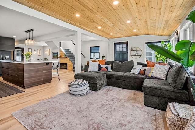 living room with wood ceiling, stairs, lofted ceiling, light wood-style floors, and recessed lighting