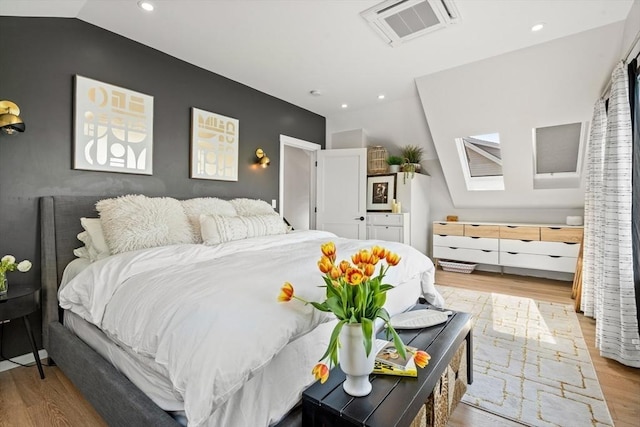 bedroom with recessed lighting, visible vents, and light wood-type flooring