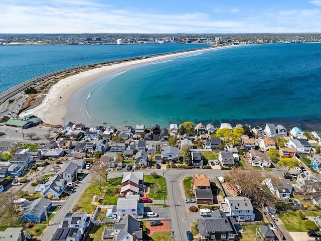 drone / aerial view with a water view and a residential view