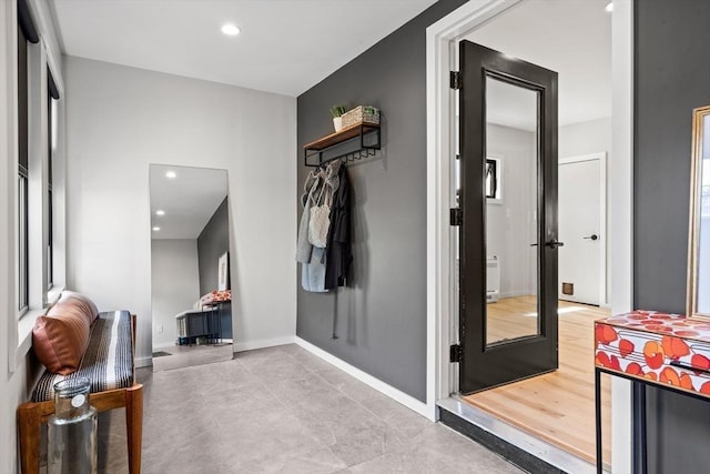 interior space with recessed lighting and baseboards