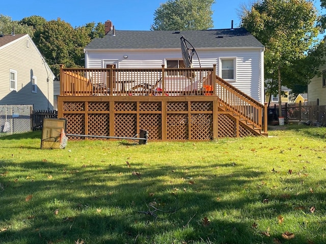 back of house with a yard and a wooden deck