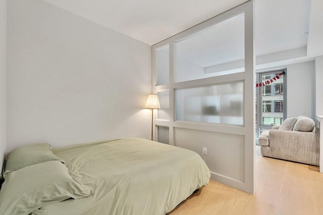 bedroom with light hardwood / wood-style flooring