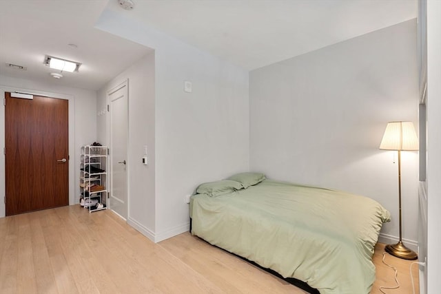 bedroom featuring light hardwood / wood-style flooring