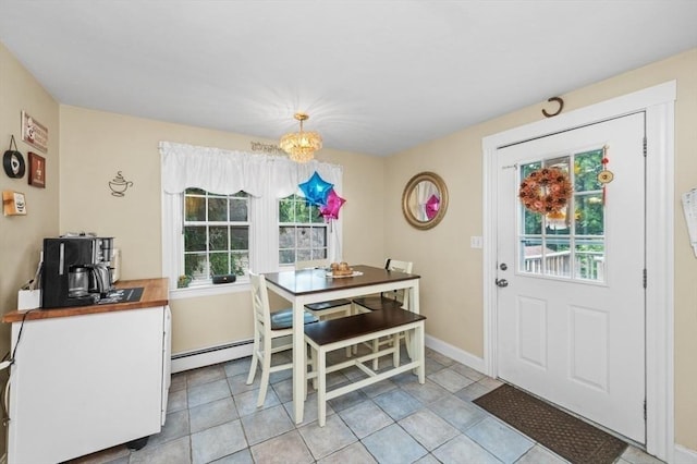 251 Main St, Ashland, MA 01721 - dining area featuring a chandelier and baseboards