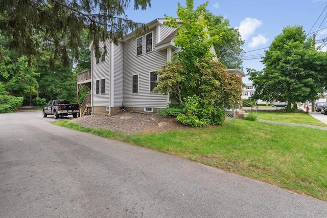 251 Main St, Ashland, MA 01721 - view of home's exterior featuring a yard