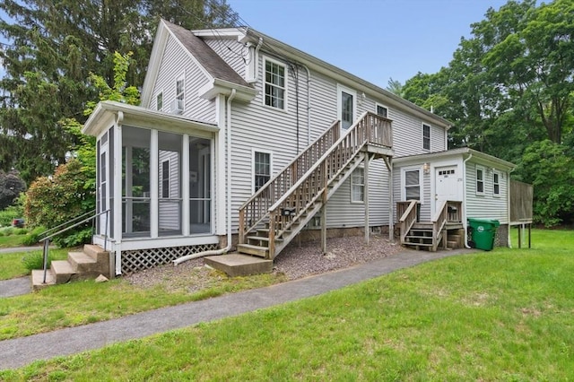 251 Main St, Ashland, MA 01721 - rear view of property with entry steps, a sunroom, a yard, and stairs