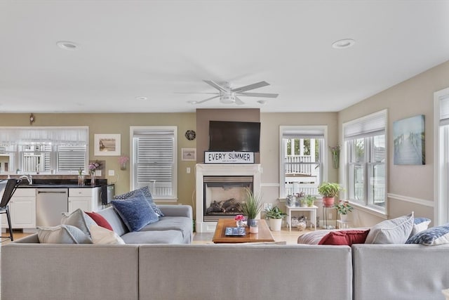 13 11th St W, Salisbury, MA 01952 - living room with a ceiling fan, a fireplace, and recessed lighting
