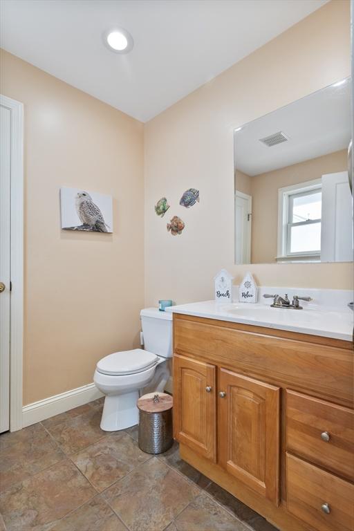 13 11th St W, Salisbury, MA 01952 - bathroom with vanity, toilet, and baseboards