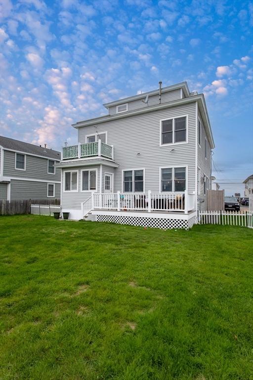 13 11th St W, Salisbury, MA 01952 - back of property with a balcony and a deck