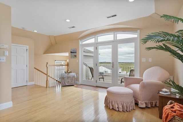 13 11th St W, Salisbury, MA 01952 - living area featuring an upstairs landing, plenty of natural light, light wood-style flooring, french doors, and recessed lighting