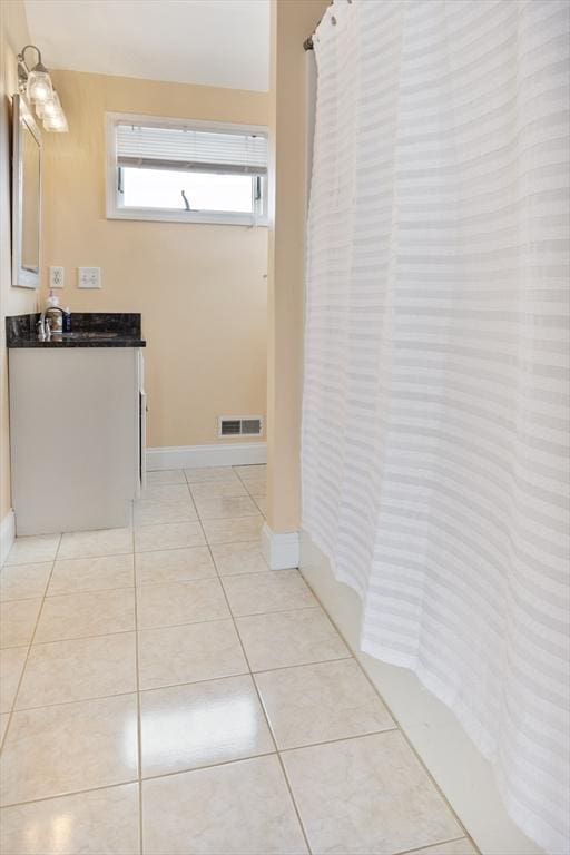 13 11th St W, Salisbury, MA 01952 - full bathroom with vanity, baseboards, tile patterned floors, and a shower with curtain
