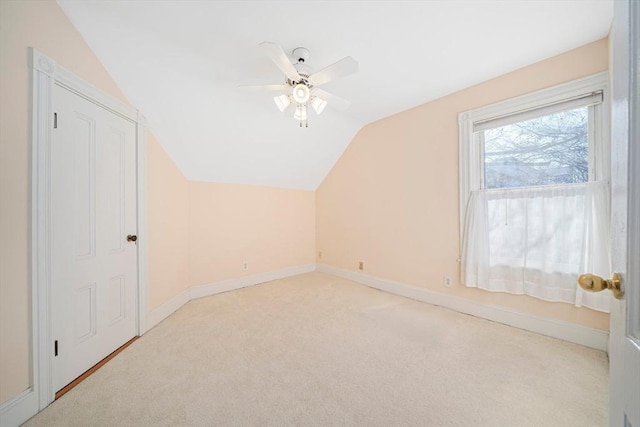 bonus room with light colored carpet, ceiling fan, and lofted ceiling