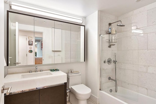 bathroom featuring vanity, shower / tub combination, and toilet