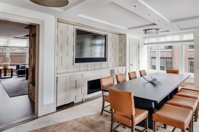 dining room featuring beamed ceiling, recessed lighting, wood finished floors, and coffered ceiling