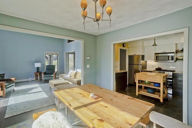 dining area with a notable chandelier and a baseboard radiator