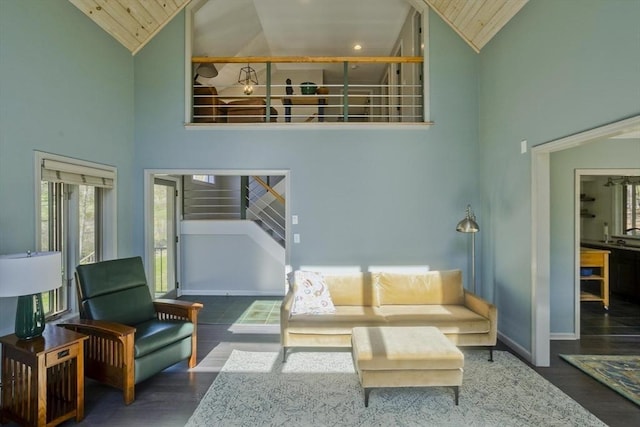 living room featuring wood ceiling, high vaulted ceiling, and wood finished floors
