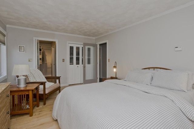 bedroom featuring a closet and light wood-style floors