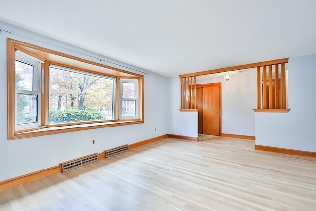 unfurnished living room with light wood-type flooring