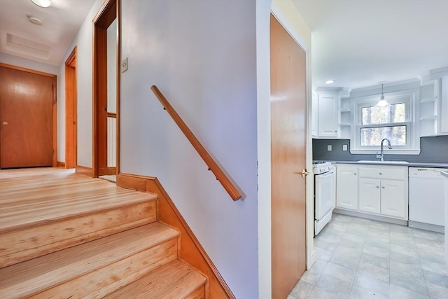 staircase featuring sink