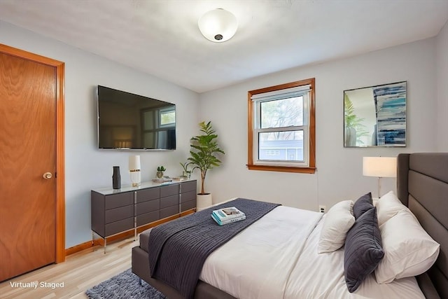 bedroom with light hardwood / wood-style flooring