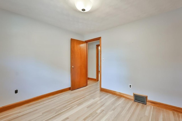 unfurnished room with light hardwood / wood-style floors