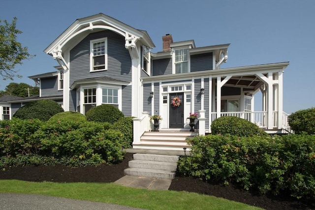 119 Mann Hill Rd, Scituate, MA 02066 - view of front of house with a chimney and covered porch