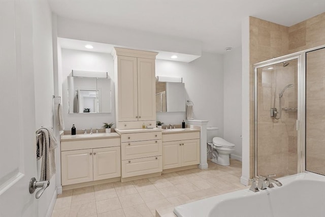 full bathroom featuring double vanity, a stall shower, a sink, and a bathtub